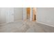 Bedroom with neutral carpet and trim and doors to the hallway and bathroom at 3006 W 107Th Pl # D, Westminster, CO 80031