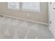 Bedroom features neutral carpet, blinds on the windows, and base trim at 3006 W 107Th Pl # D, Westminster, CO 80031