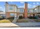 Charming two-story townhome featuring brick facade, neutral trim, and well-maintained landscaping at 3006 W 107Th Pl # D, Westminster, CO 80031