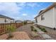 Charming backyard featuring a rock garden, stepping stones, and a wooden fence at 1592 Maggie Mae Ln, Castle Rock, CO 80104