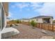 Spacious backyard with rock landscaping, a wooden fence, and a patio perfect for outdoor living at 1592 Maggie Mae Ln, Castle Rock, CO 80104