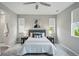 Bright bedroom with neutral tones, carpet, and windows with privacy shades at 1592 Maggie Mae Ln, Castle Rock, CO 80104