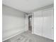 Inviting bedroom showcasing gray walls, carpeted floor, and sliding door closet at 1592 Maggie Mae Ln, Castle Rock, CO 80104