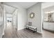 Inviting entryway featuring modern decor, stylish bench seating, and sleek flooring at 1592 Maggie Mae Ln, Castle Rock, CO 80104