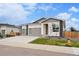Charming single-Gathering home boasting a three-car garage, and modern architectural design with stone accents at 1592 Maggie Mae Ln, Castle Rock, CO 80104