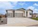 Charming single-Gathering home boasting a three-car garage, and modern architectural design with stone accents at 1592 Maggie Mae Ln, Castle Rock, CO 80104