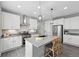 Spacious kitchen with stainless steel appliances, white cabinets, and a large center island at 1592 Maggie Mae Ln, Castle Rock, CO 80104