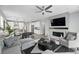 Contemporary living room featuring a sleek fireplace, recessed lighting, and an open-concept design at 1592 Maggie Mae Ln, Castle Rock, CO 80104