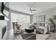 Stylish living room showcasing a gray sectional sofa, fireplace, and modern decor with lots of light at 1592 Maggie Mae Ln, Castle Rock, CO 80104