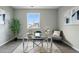 Bright office space featuring a modern glass desk, neutral decor, and ample natural light at 1592 Maggie Mae Ln, Castle Rock, CO 80104