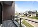 Private balcony with glass railing overlooking the street and neighborhood at 2821 E Cedar Ave # 17, Denver, CO 80209
