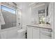Modern bathroom with walk-in shower, decorative tile, and sleek vanity at 2821 E Cedar Ave # 17, Denver, CO 80209