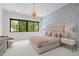 Charming bedroom with large window and decorative lighting at 2821 E Cedar Ave # 17, Denver, CO 80209