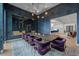 Elegant dining room with wine storage, statement lighting, and seating for eight at 2821 E Cedar Ave # 17, Denver, CO 80209
