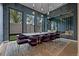 Modern dining room featuring a large table, stylish chairs, and floor-to-ceiling windows at 2821 E Cedar Ave # 17, Denver, CO 80209