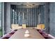 Close-up of a dining table, showcasing elegant chairs and built-in wine storage at 2821 E Cedar Ave # 17, Denver, CO 80209