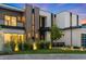 Sophisticated modern home with meticulous landscaping and exterior lighting, highlighting its unique facade at 2821 E Cedar Ave # 17, Denver, CO 80209