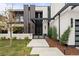 Contemporary home with clean lines, a gated entryway, and sleek modern lighting fixtures at 2821 E Cedar Ave # 17, Denver, CO 80209