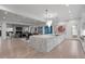 Spacious kitchen with an island open to living area, featuring hardwood floors and modern design at 2821 E Cedar Ave # 17, Denver, CO 80209