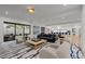 Spacious living room featuring open-concept design, large windows, modern furniture, and stylish decor at 2821 E Cedar Ave # 17, Denver, CO 80209