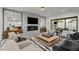 Bright and spacious living room with a modern fireplace, sleek furnishings, and access to an outdoor patio at 2821 E Cedar Ave # 17, Denver, CO 80209