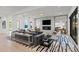 Open-concept living area with a modern fireplace, plush seating, and stylish decor at 2821 E Cedar Ave # 17, Denver, CO 80209