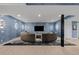 Luxurious living room featuring textured blue wallpaper, unique lighting, and a stylish curved sofa at 2821 E Cedar Ave # 17, Denver, CO 80209