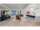 Expansive living room with modern art, bar seating, and a seamless indoor-outdoor flow at 2821 E Cedar Ave # 17, Denver, CO 80209
