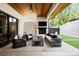 Elegant covered patio featuring a fireplace, TV, and comfortable seating, perfect for outdoor entertaining at 2821 E Cedar Ave # 17, Denver, CO 80209