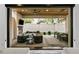 Outdoor living area featuring a fireplace, ceiling fan, and a dining table with seating for eight at 2821 E Cedar Ave # 17, Denver, CO 80209