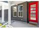 Charming home featuring a brick exterior, bright red door, and modern windows at 888 S Valentia St # 14-103, Denver, CO 80247