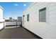Spacious rooftop deck with modern railing, offering ample space for outdoor living and entertaining at 888 S Valentia St # 14-103, Denver, CO 80247