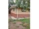 Rear view of the home highlighting the brick and siding exterior details at 6911 Weiman Ct, Commerce City, CO 80022