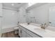 Bright bathroom with double sink vanity, a shower/tub, and modern fixtures at 25254 E Warren Pl, Aurora, CO 80018
