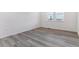 Bright bedroom with large windows, luxury vinyl plank flooring, and neutral color palette at 25254 E Warren Pl, Aurora, CO 80018