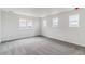 This spacious bedroom has three windows for plenty of natural light at 25254 E Warren Pl, Aurora, CO 80018