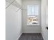 A well-lit closet features wire shelving and a window with neighborhood view at 25254 E Warren Pl, Aurora, CO 80018