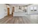 Modern kitchen with center island, stainless steel appliances, and views to the backyard at 25254 E Warren Pl, Aurora, CO 80018