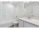 Bright bathroom with a shower and tub combo, and a modern vanity with white countertop at 4464 Boone Cir, Brighton, CO 80601