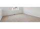 Cozy bedroom with neutral carpet and bright window, ready for your personal touch at 4464 Boone Cir, Brighton, CO 80601