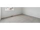 Comfortable bedroom features plush carpeting, a bright window, and ample space at 4464 Boone Cir, Brighton, CO 80601