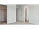 Hallway with an open closet, door to another room and doorway to an additional room at 4464 Boone Cir, Brighton, CO 80601