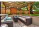 Cozy outdoor patio area featuring a pergola, comfortable seating, and a stylish fire pit table at 3835 Pecos St, Denver, CO 80211