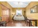 Charming room with a light fixture and wood floors is accented by natural light from the window at 5048 Rocky Mountain Dr, Castle Rock, CO 80109
