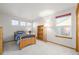 Bright bedroom features wood-trimmed windows, a single bed, and a matching wood bookshelf at 5048 Rocky Mountain Dr, Castle Rock, CO 80109