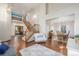 Bright foyer with hardwood floors, a staircase, and views into the living and dining areas at 5048 Rocky Mountain Dr, Castle Rock, CO 80109