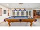 Finished basement game room features a pool table, and large windows for natural light at 5048 Rocky Mountain Dr, Castle Rock, CO 80109