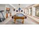 Finished basement game room featuring a pool table, beverage center, and a small home gym at 5048 Rocky Mountain Dr, Castle Rock, CO 80109