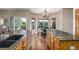 Open kitchen layout with a breakfast nook featuring a table and backyard views at 5048 Rocky Mountain Dr, Castle Rock, CO 80109