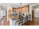Spacious kitchen featuring wood cabinets, granite countertops, stainless steel appliances, and a center island at 5048 Rocky Mountain Dr, Castle Rock, CO 80109